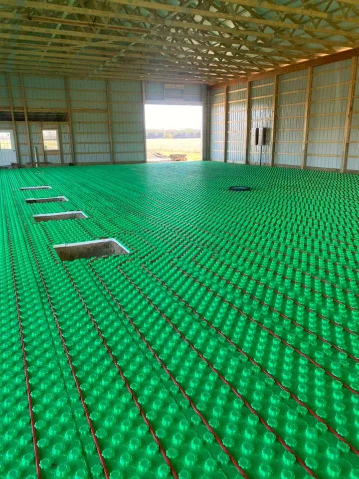 Radiant floor heating PEX tubing in commercial barn